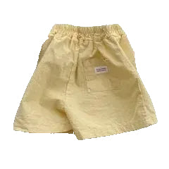 Children's outfit with white t-shirt, yellow shorts, and gray boots on a gray background, branded 'BLACKBEAN bebe'.