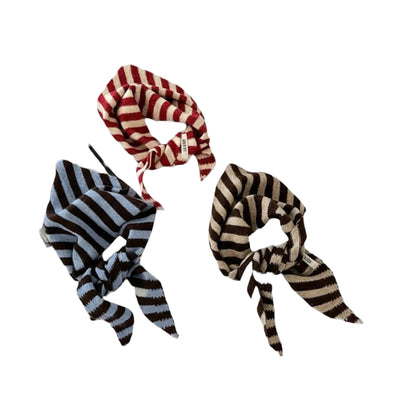 Four striped hair accessories on a white background